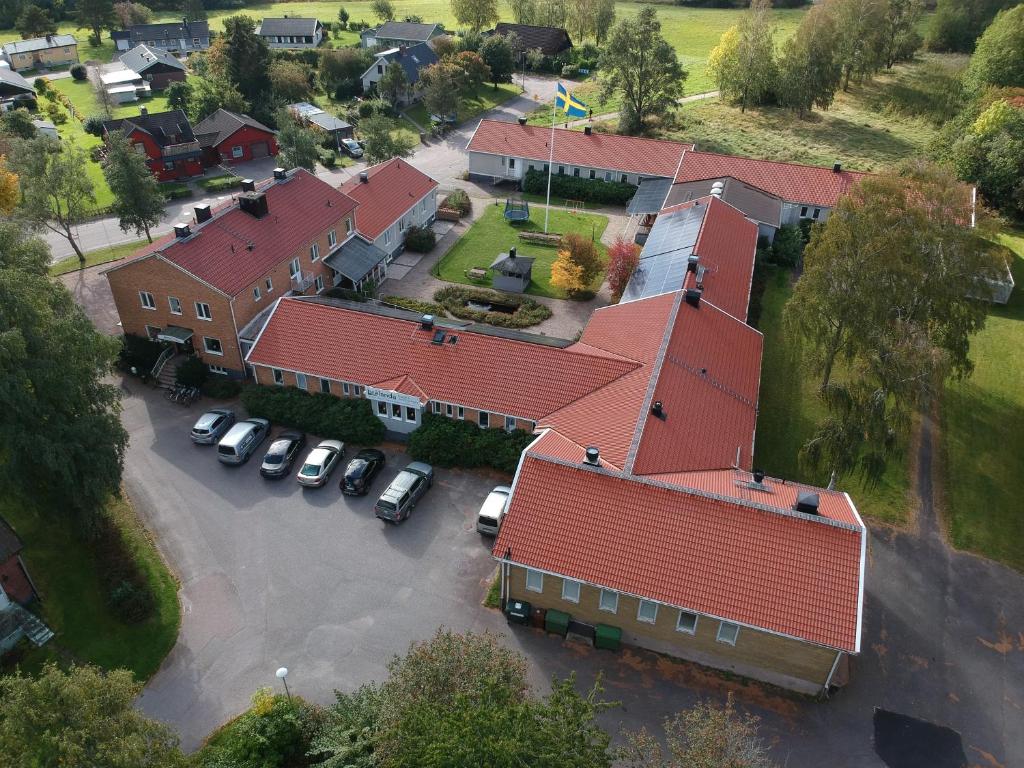 an overhead view of a house with red roofs at Brålanda Hotell och Vandrarhem in Brålanda