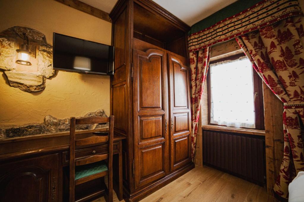 TV a/nebo společenská místnost v ubytování Hotel Jumeaux