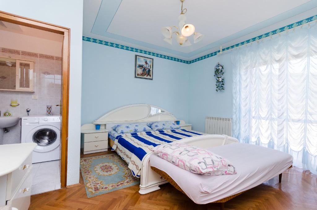Postel nebo postele na pokoji v ubytování Apartments VESNA