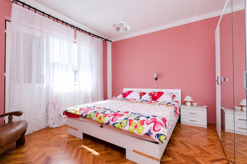 Postel nebo postele na pokoji v ubytování Apartments VESNA