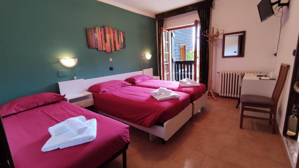 Postel nebo postele na pokoji v ubytování Hotel Edelweiss
