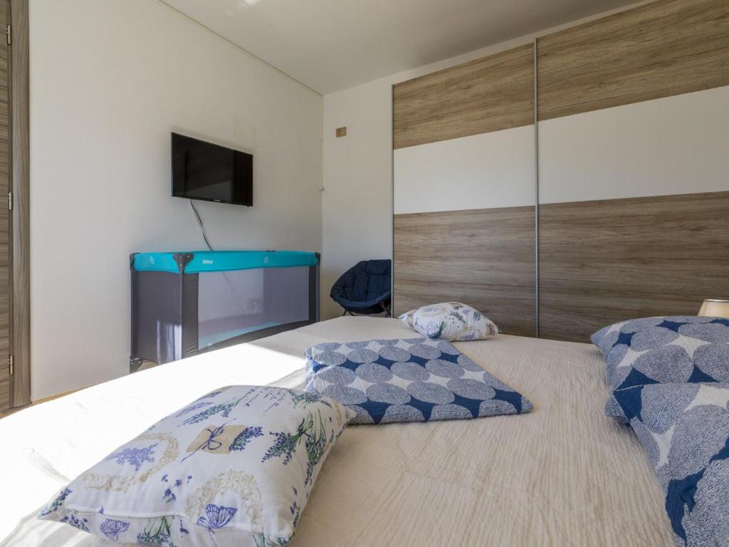 Postel nebo postele na pokoji v ubytování Villa Odiseja