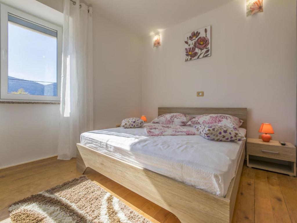 Postel nebo postele na pokoji v ubytování Villa Odiseja