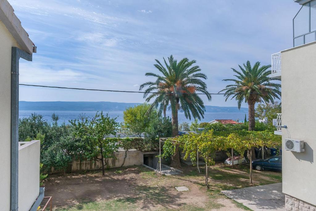 a view of the ocean from a house at Apartments Marija in Duće