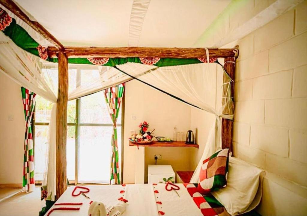 Postel nebo postele na pokoji v ubytování Tropicana Garden