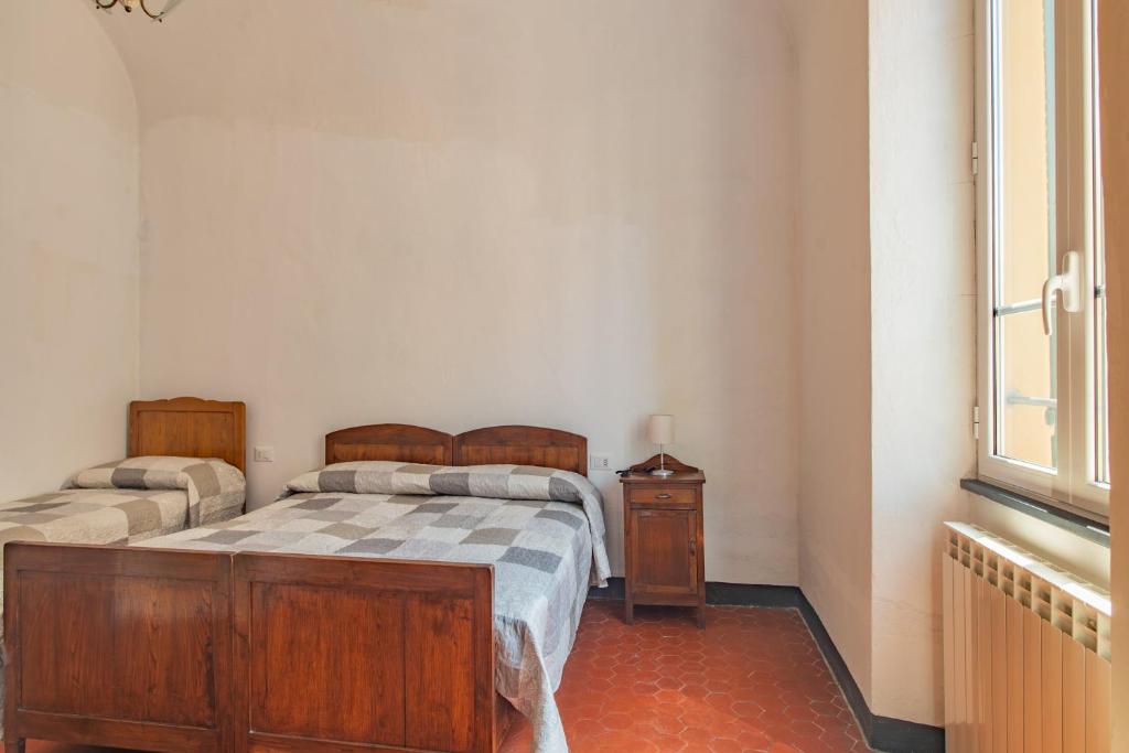 Posteľ alebo postele v izbe v ubytovaní Rivierarent Casa Iolanda