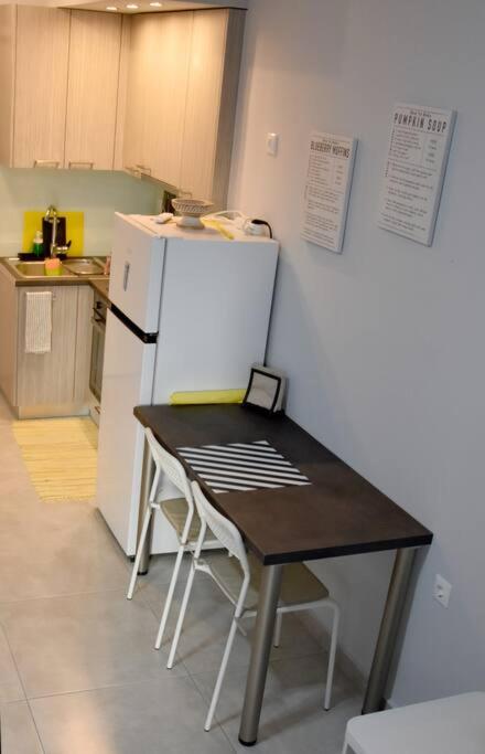 Kuchyň nebo kuchyňský kout v ubytování Homeyfeel Stay Sea 1 - Modern studio next to the sea!