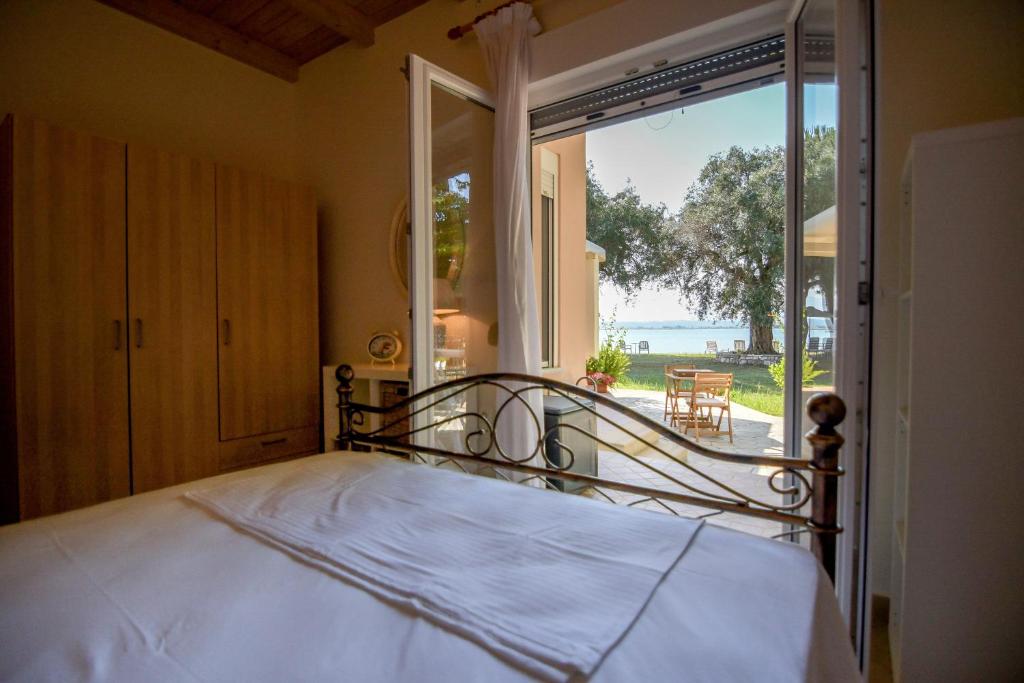 A bed or beds in a room at Kiani Akti Villas