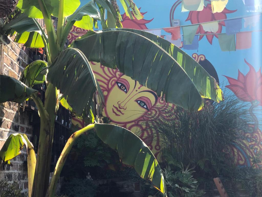 a painting of a monkey behind a banana plant at The Beetroot in Margate