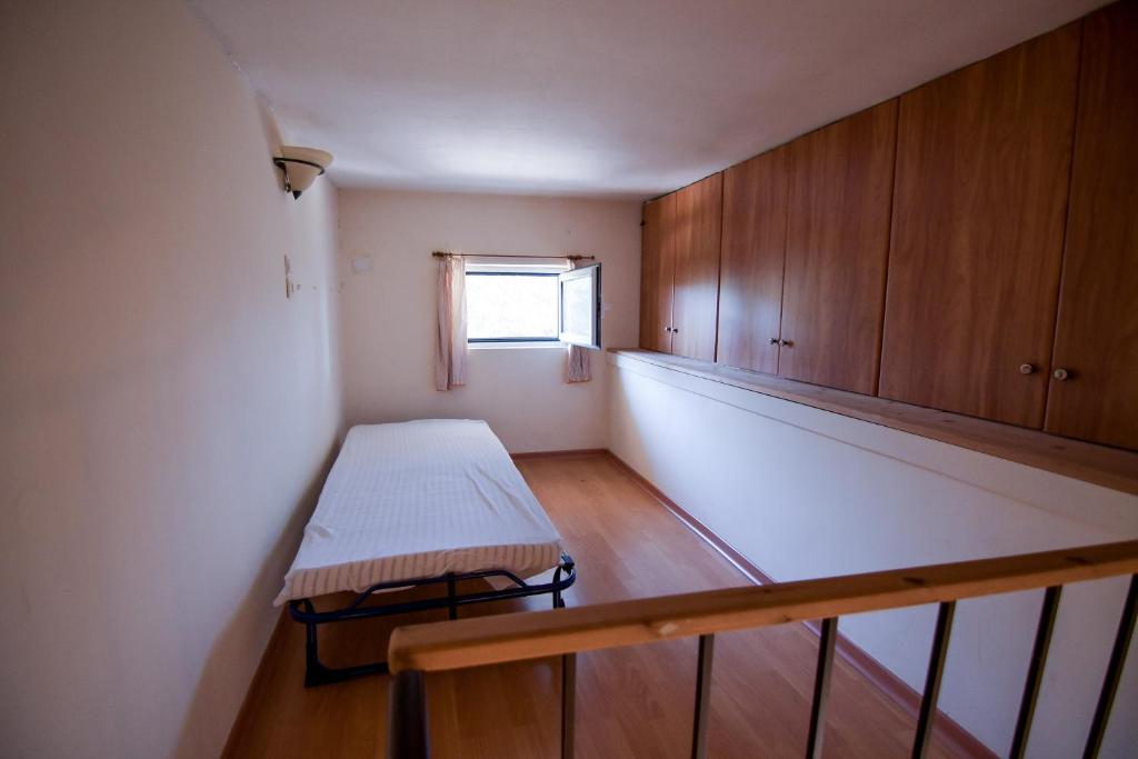 A bed or beds in a room at Kiani Akti Villas