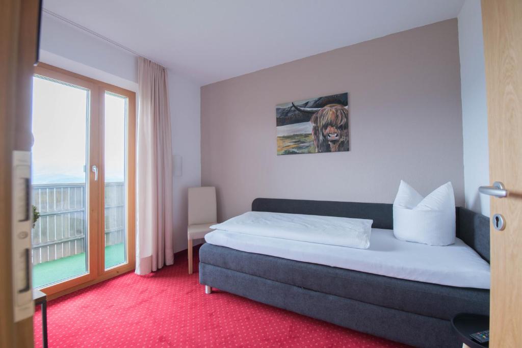 Letto o letti in una camera di Frühstückspension Bilgeri