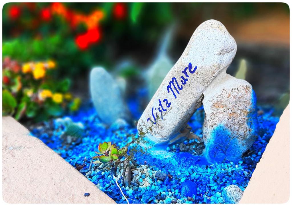 a rock with the word mum written on it in a garden at VistaMare in Villaputzu