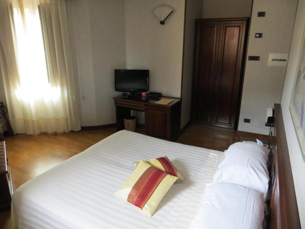 Postel nebo postele na pokoji v ubytování Hotel Fonte Cesia