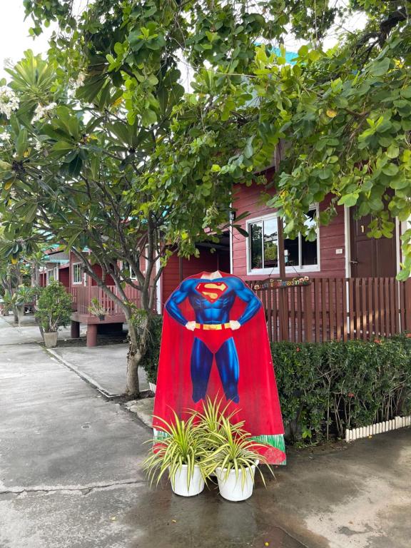 a cape over two potted plants in front of a house at Kalae Resort in Ban Nong Ben