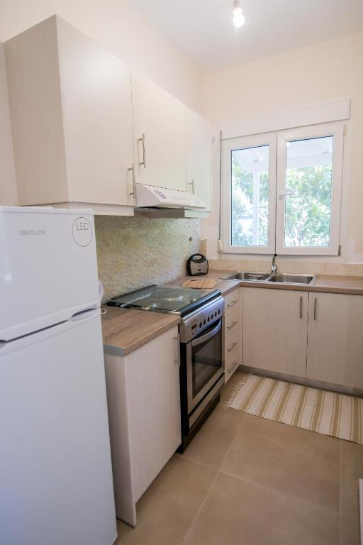 A kitchen or kitchenette at Kiani Akti Villas