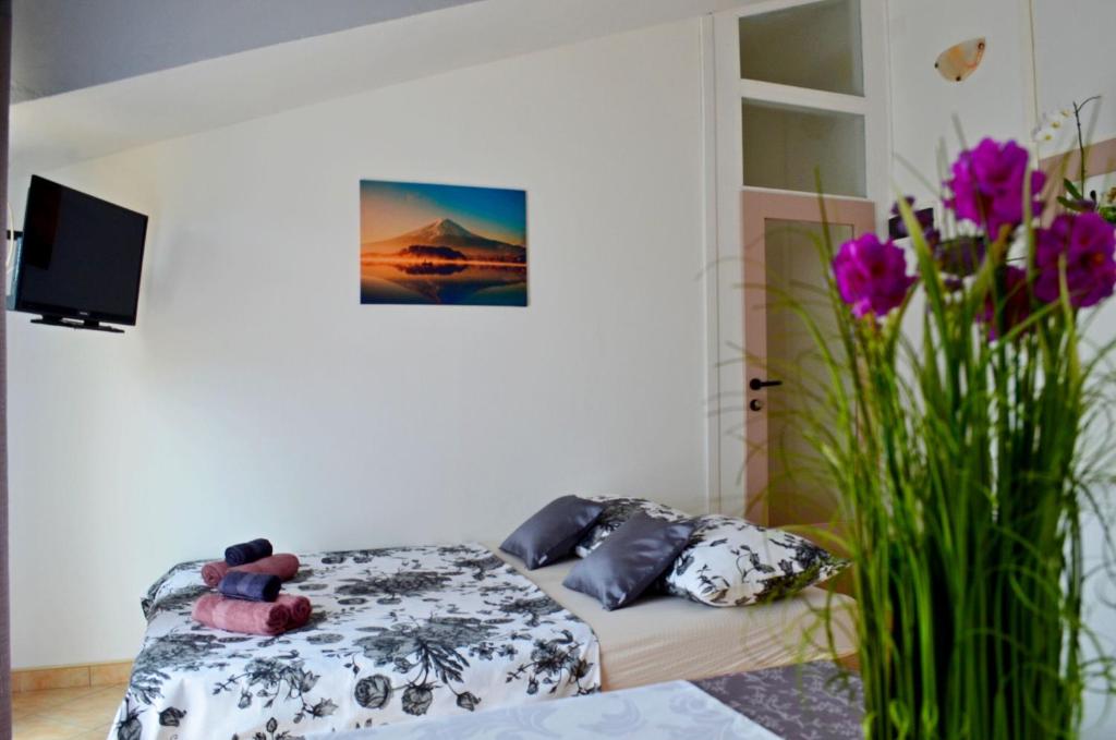 Postel nebo postele na pokoji v ubytování Apartments Davorka