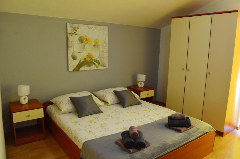 Postel nebo postele na pokoji v ubytování Apartments Davorka