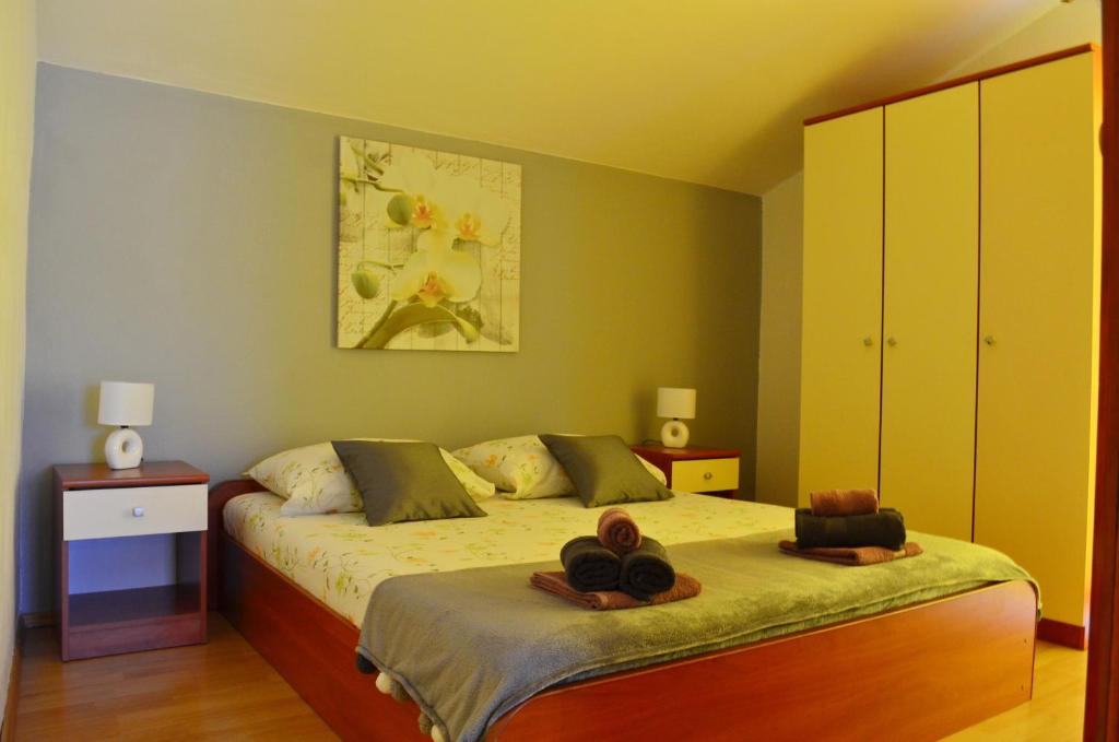 Postel nebo postele na pokoji v ubytování Apartments Davorka