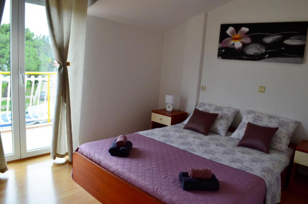 Postel nebo postele na pokoji v ubytování Apartments Davorka