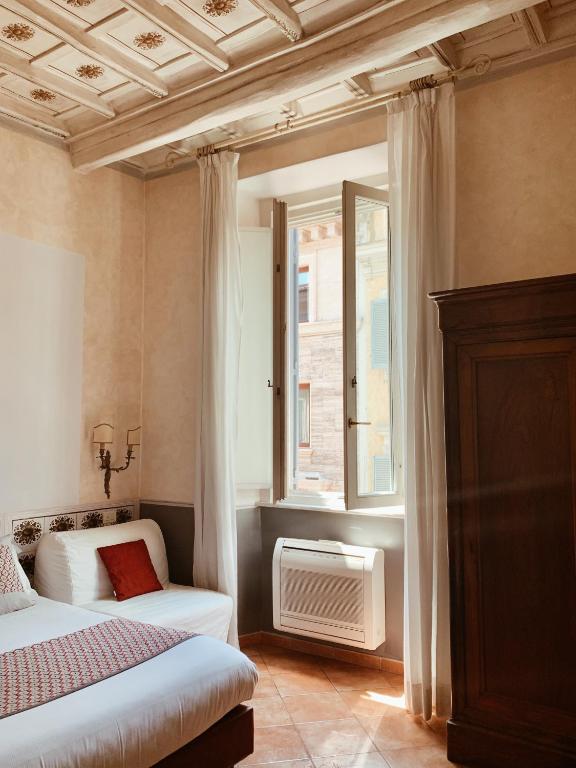 A bed or beds in a room at Residenza Sciarra B&B