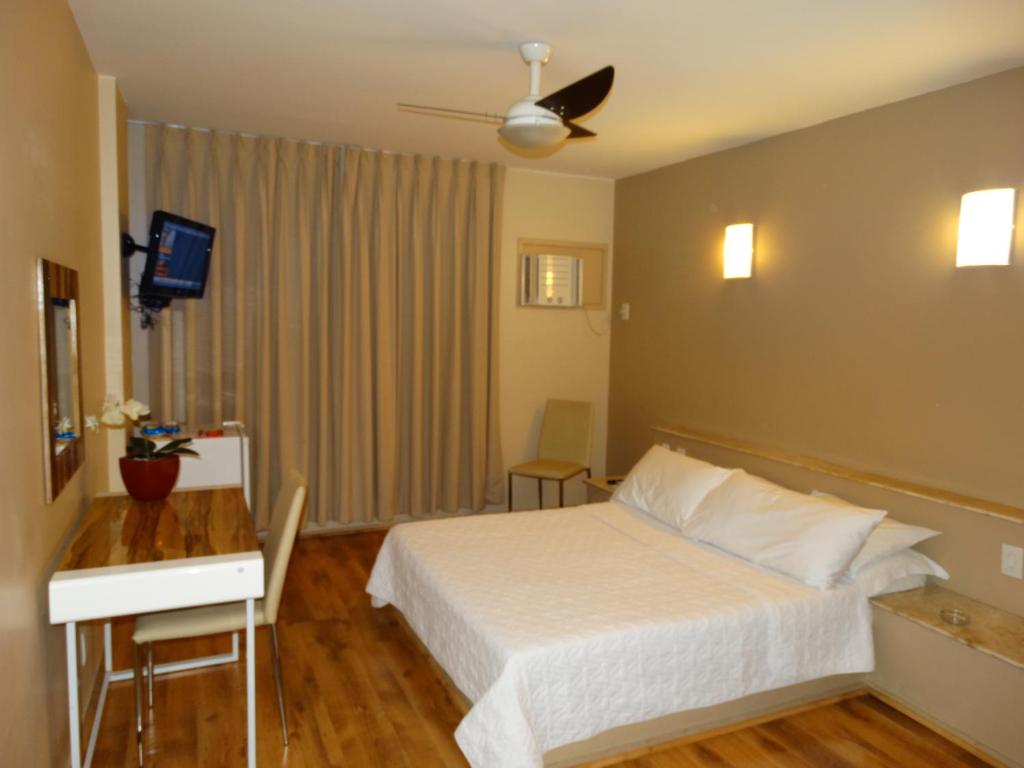 Кровать или кровати в номере Niteroi Palace Hotel