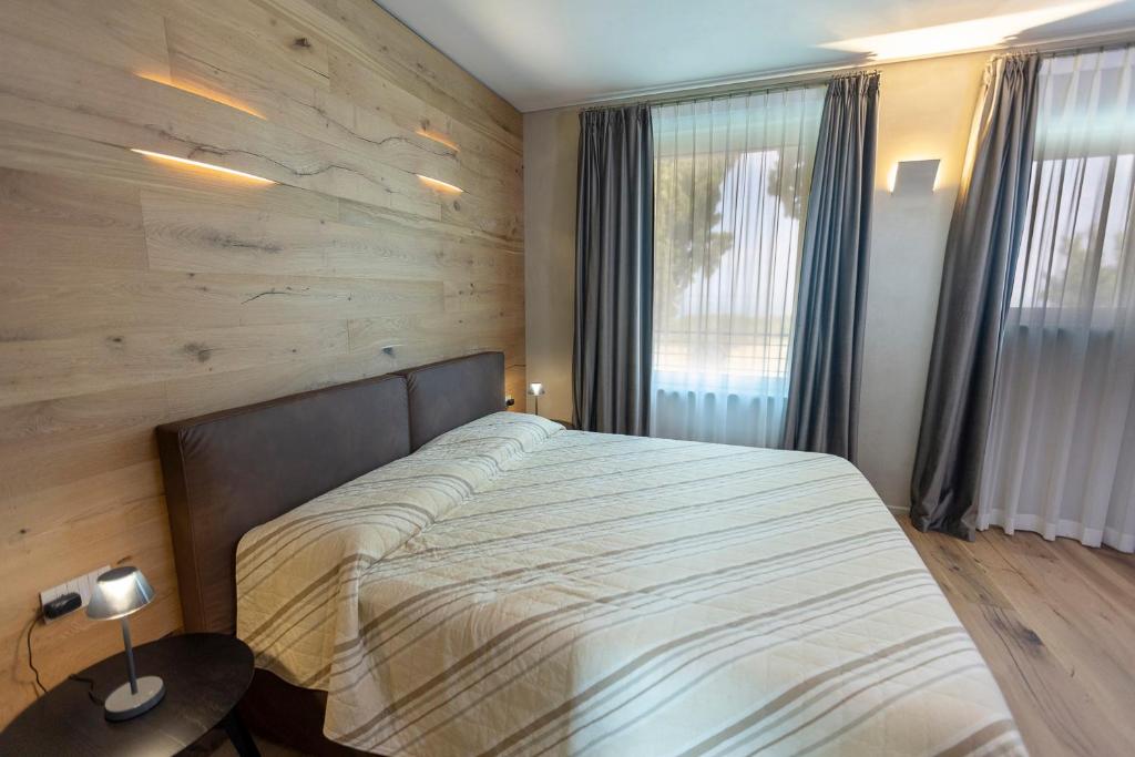 Postel nebo postele na pokoji v ubytování Eremus Relais