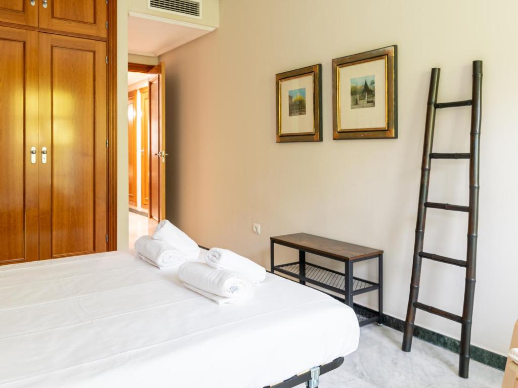 Posteľ alebo postele v izbe v ubytovaní Tejares Suite Córdoba
