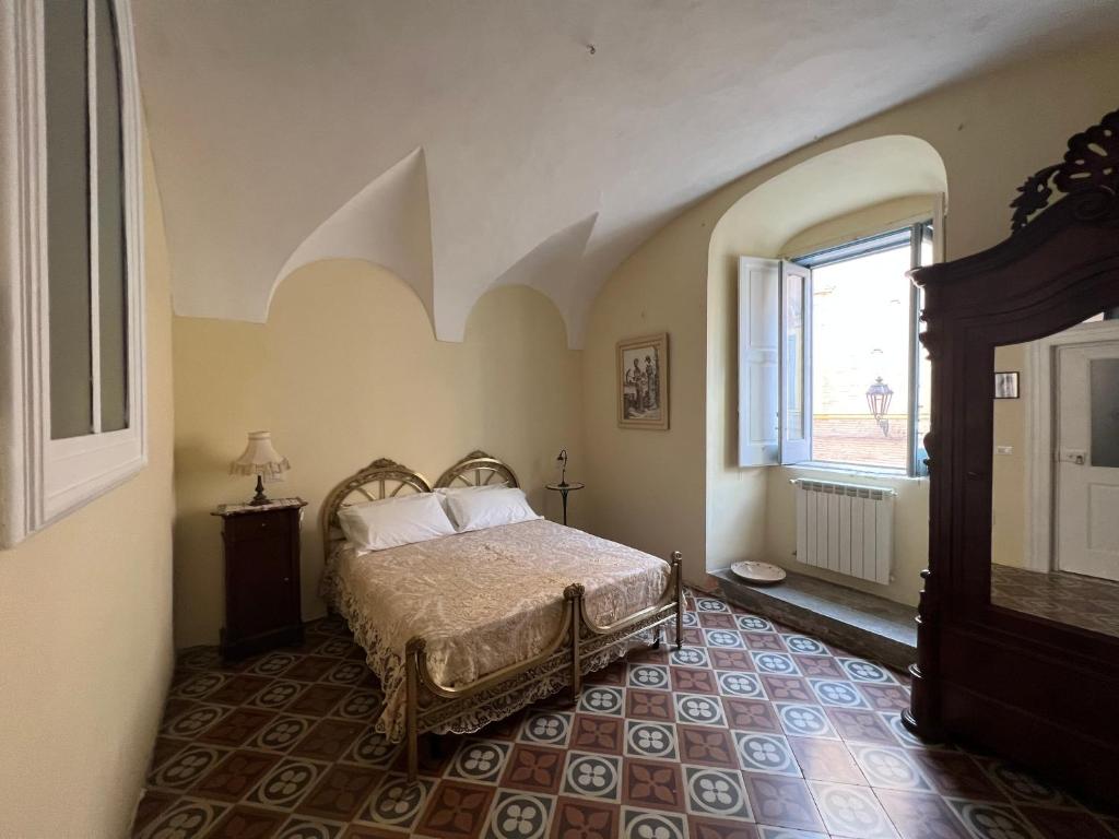 Postel nebo postele na pokoji v ubytování B&B Palazzo Lombardi