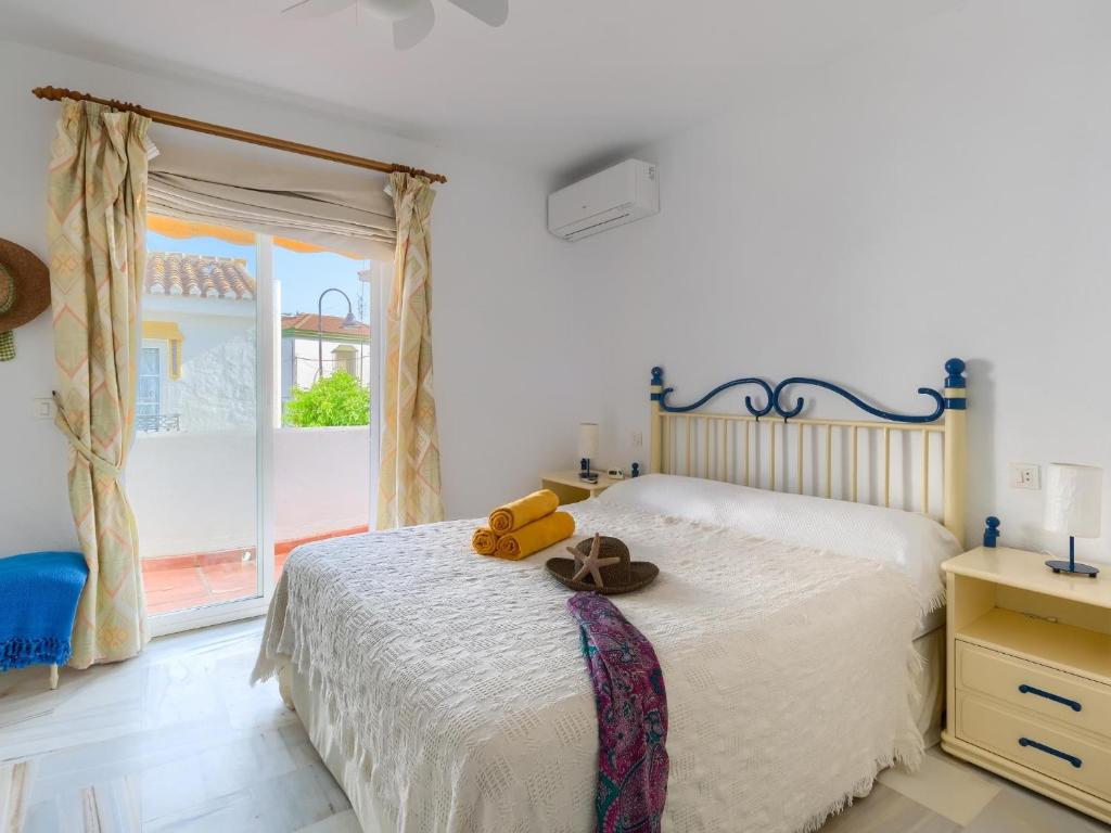 Posteľ alebo postele v izbe v ubytovaní 31 Mijas Playa Club townhouse La Cala
