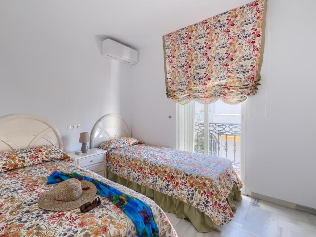 Posteľ alebo postele v izbe v ubytovaní 31 Mijas Playa Club townhouse La Cala