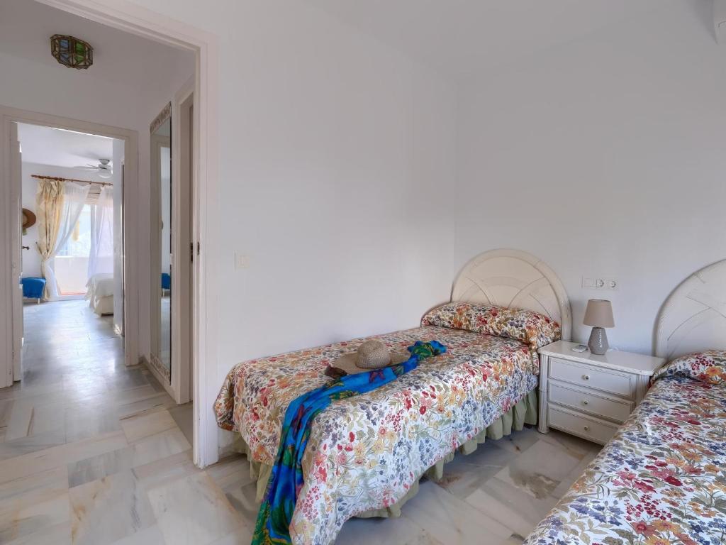 Posteľ alebo postele v izbe v ubytovaní 31 Mijas Playa Club townhouse La Cala