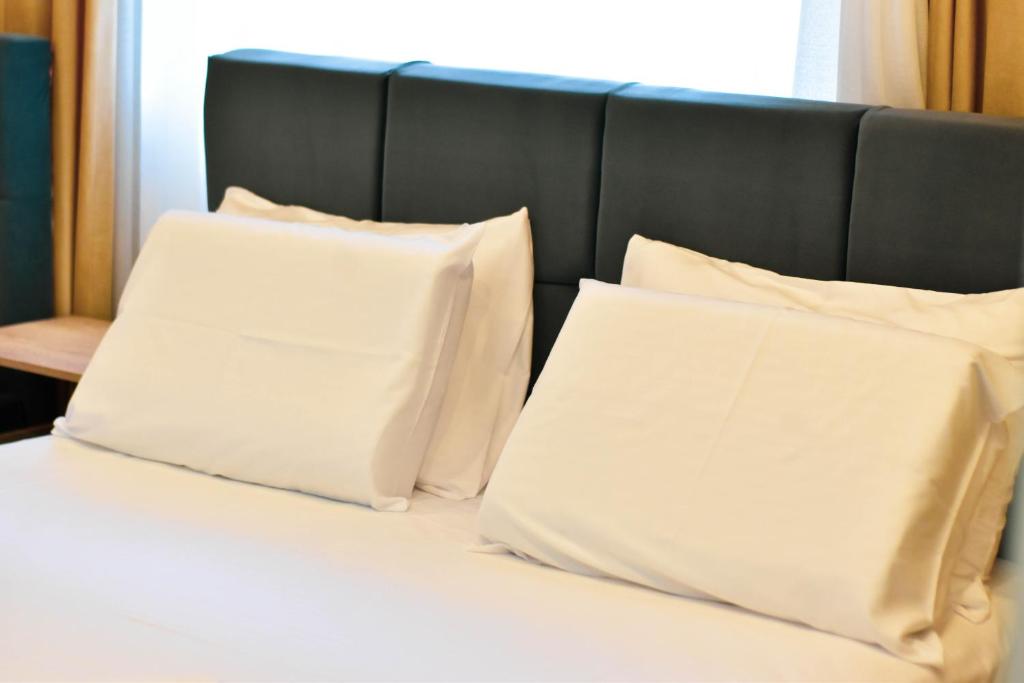 Postel nebo postele na pokoji v ubytování HotelApart - DelMar