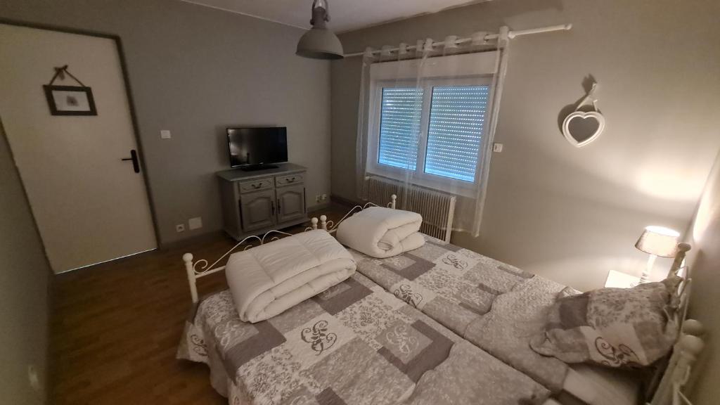 Posteľ alebo postele v izbe v ubytovaní La Préférence