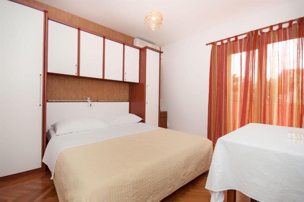 Postel nebo postele na pokoji v ubytování Apartments Ante