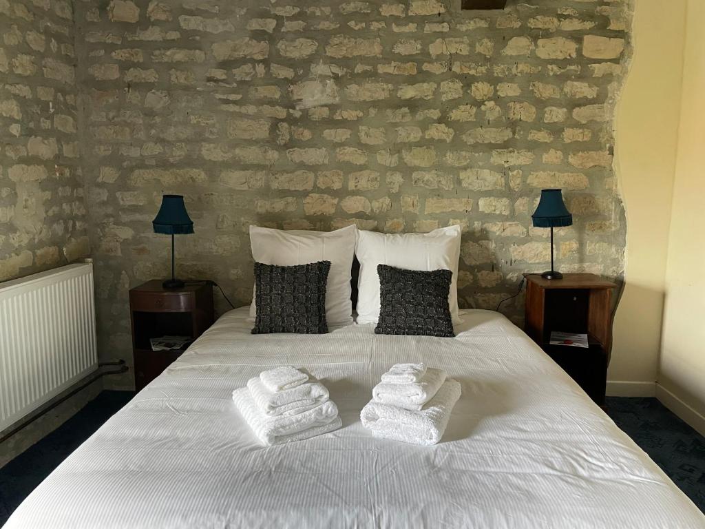 Posteľ alebo postele v izbe v ubytovaní La Ferme Delaunay