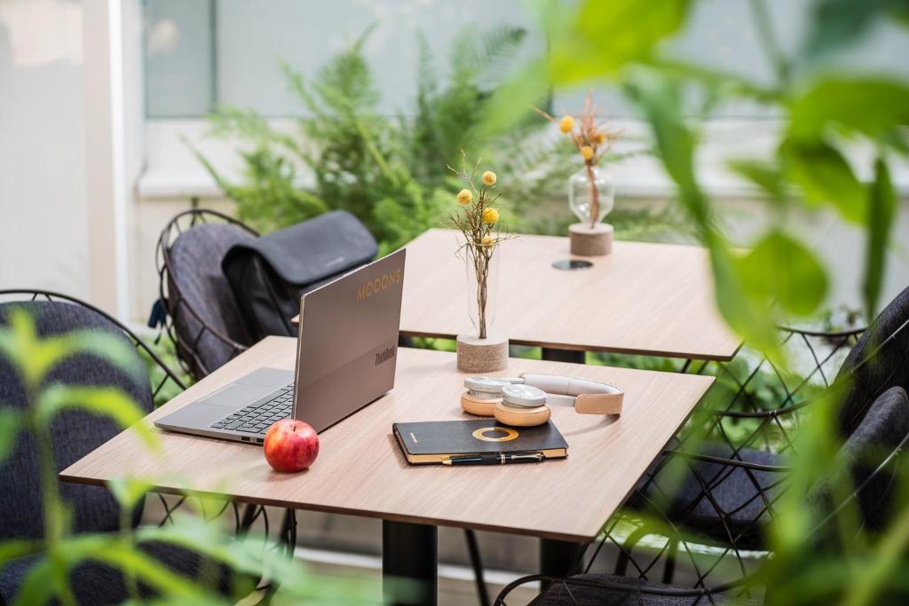 a laptop computer sitting on top of a wooden table at MOOONS Vienna in Vienna