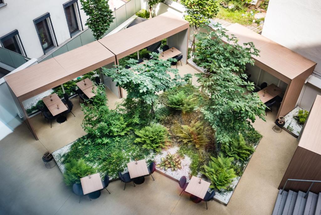 an overhead view of a cafeteria with plants at MOOONS Vienna in Vienna