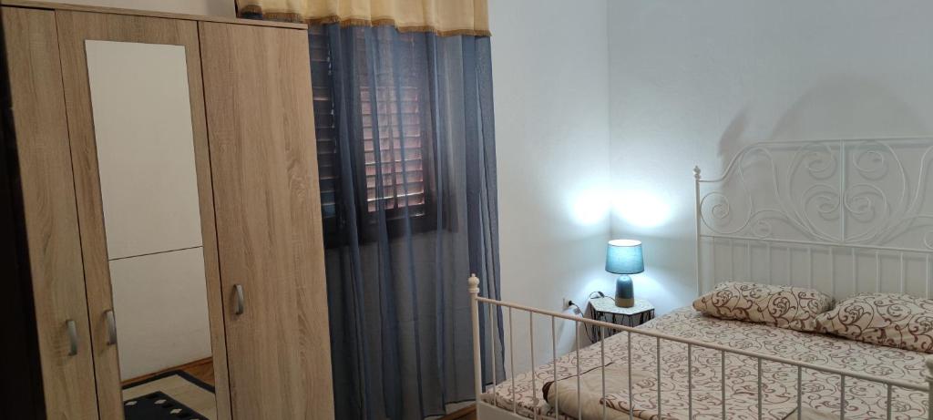 A bed or beds in a room at Bakovic Apartmani