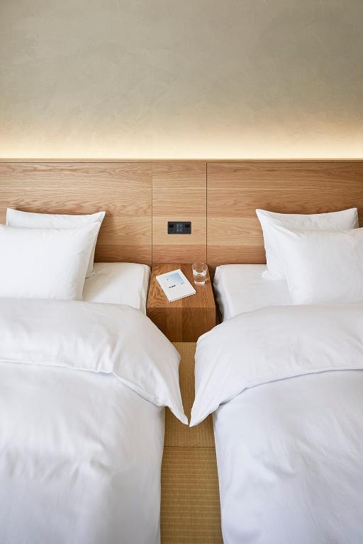 Postel nebo postele na pokoji v ubytování MUJI HOTEL GINZA