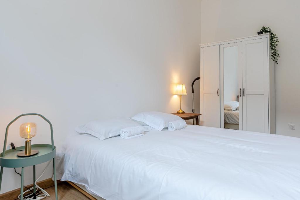 Een bed of bedden in een kamer bij Le Grain de Sable