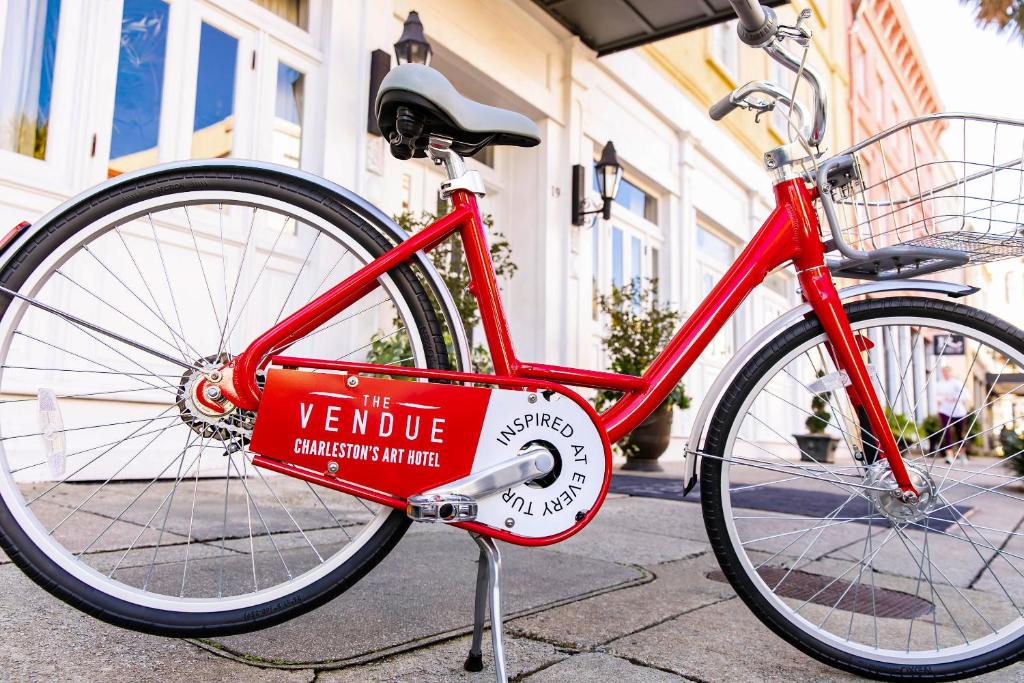 a red bike is parked on the sidewalk at The Vendue, Downtown Art Hotel in Charleston