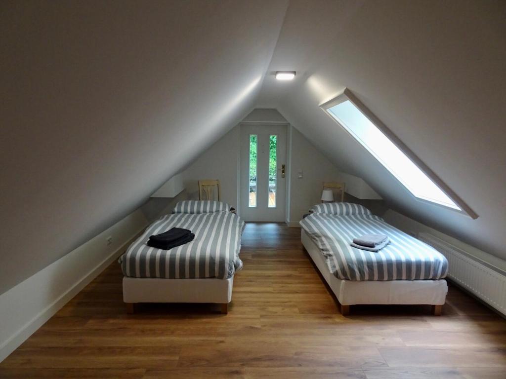 Postel nebo postele na pokoji v ubytování Ferienhaus Blommers