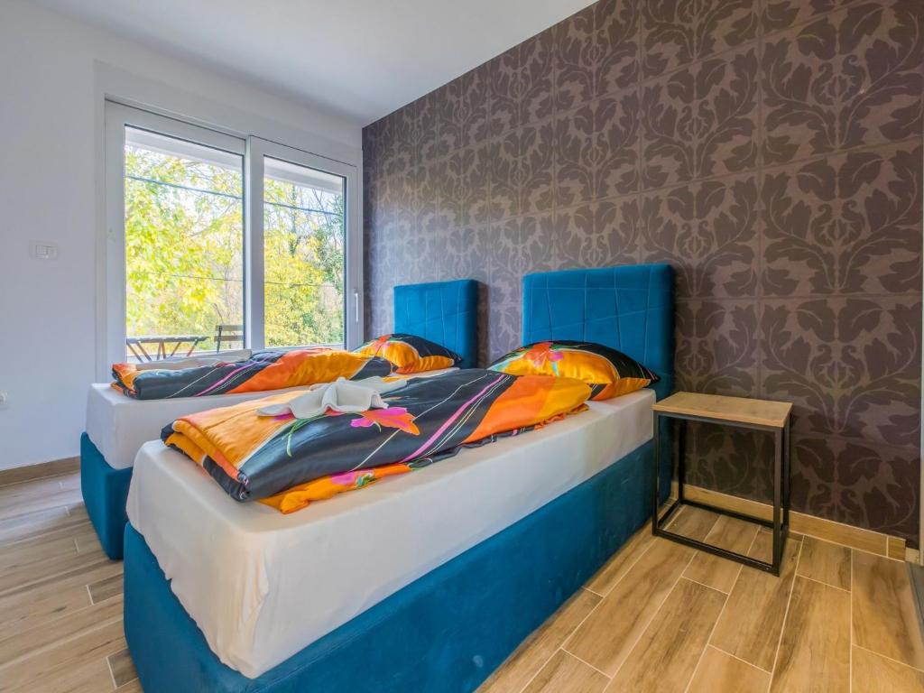 Postel nebo postele na pokoji v ubytování Villa Adry