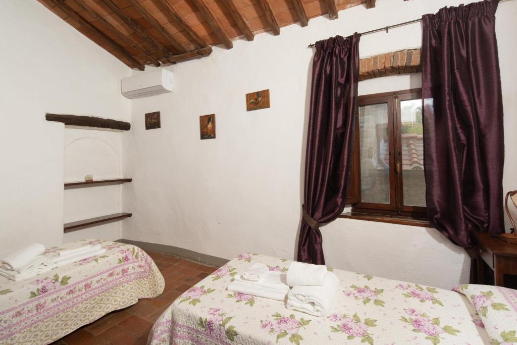 Posteľ alebo postele v izbe v ubytovaní Casa al Monte by VacaVilla