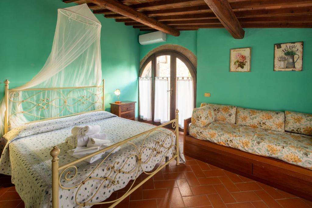 Posteľ alebo postele v izbe v ubytovaní Casa al Monte by VacaVilla