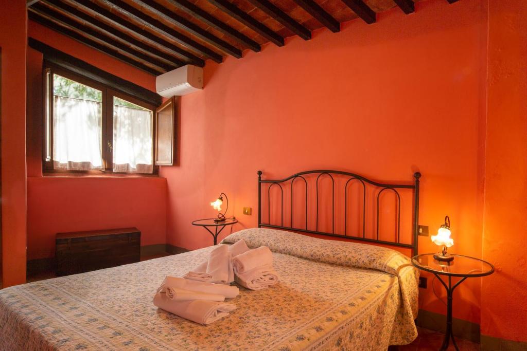 Posteľ alebo postele v izbe v ubytovaní Casa al Monte by VacaVilla