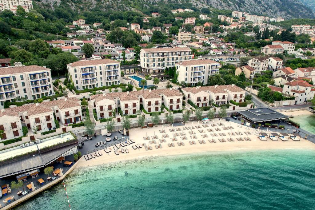 an aerial view of a resort on the beach at HUMA Kotor Bay Hotel and Villas in Kotor