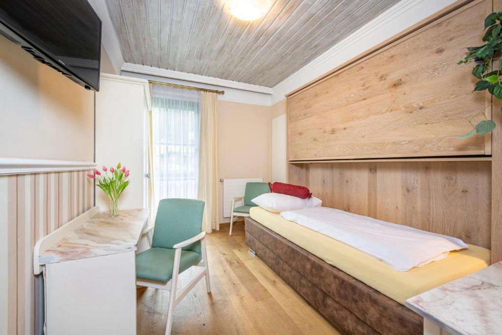 Postel nebo postele na pokoji v ubytování Hotel Garni Keil