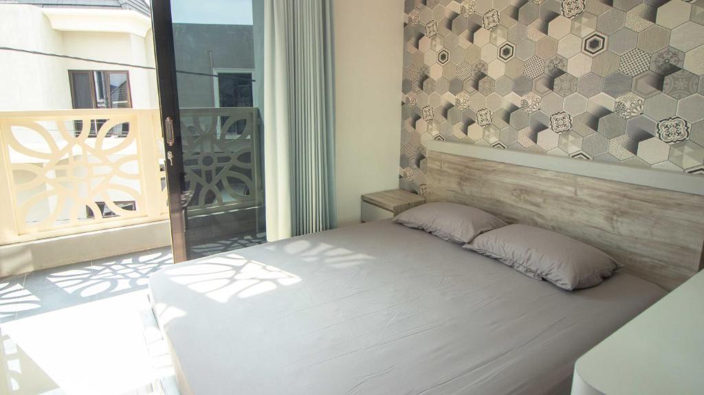 Postel nebo postele na pokoji v ubytování Villa Safari Syariah with Mountain View