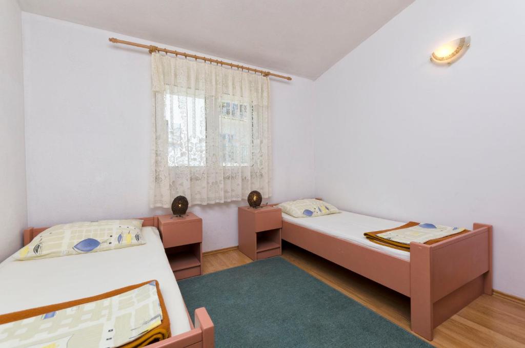 Posteľ alebo postele v izbe v ubytovaní Apartment Smiljana